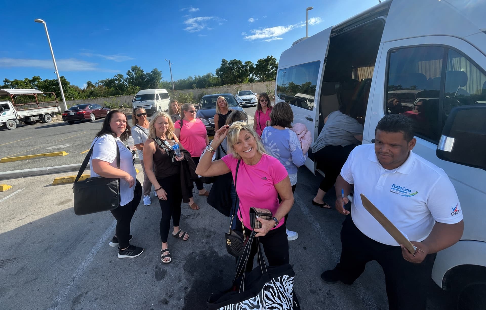 Travelers boarding a Punta Cana Airport Transfers van outside the airport